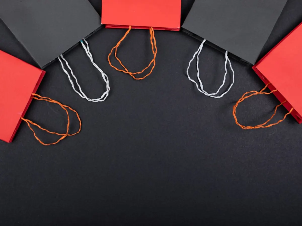 Red and black shopping bags representing retail and online commerce